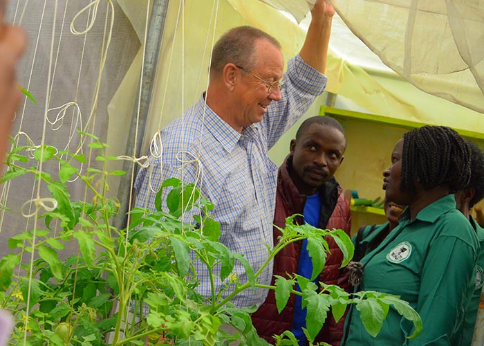 Claus Ollerking checking on MUWOFA greenhouse.